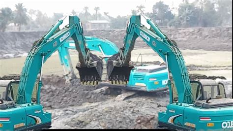 mini excavator sinking in clay|2 excavators stuck in mud.